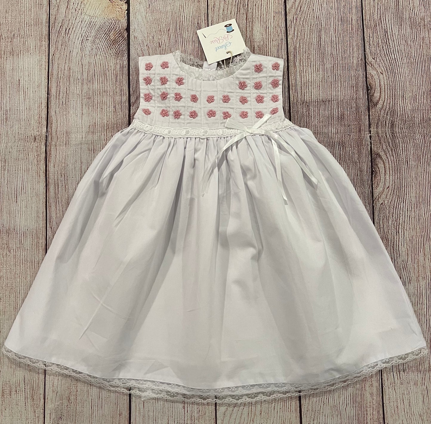 WHITE DRESS w/ PINK EMBROIDERED FLOWERS WITH WHITE RIBIBON ( fully lined )